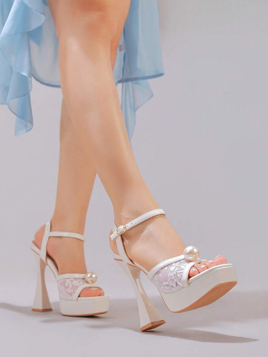 Lace embroidered open toe high heel sandals featuring a chunky square heel, platform wedge, and ankle strap buckle closure.