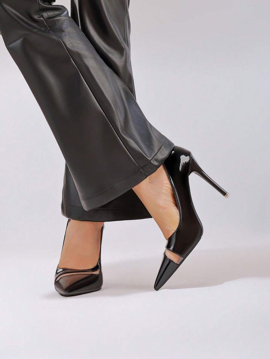 Black lace pointed toe high heel pumps featuring stiletto heels and a decorative bow accent.