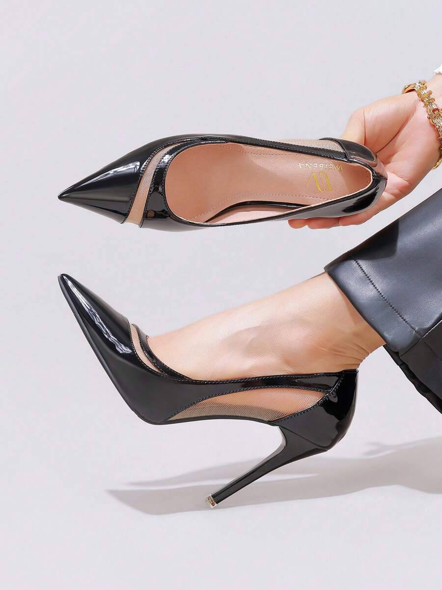 Black lace pointed toe high heel pumps featuring stiletto heels and a decorative bow accent.