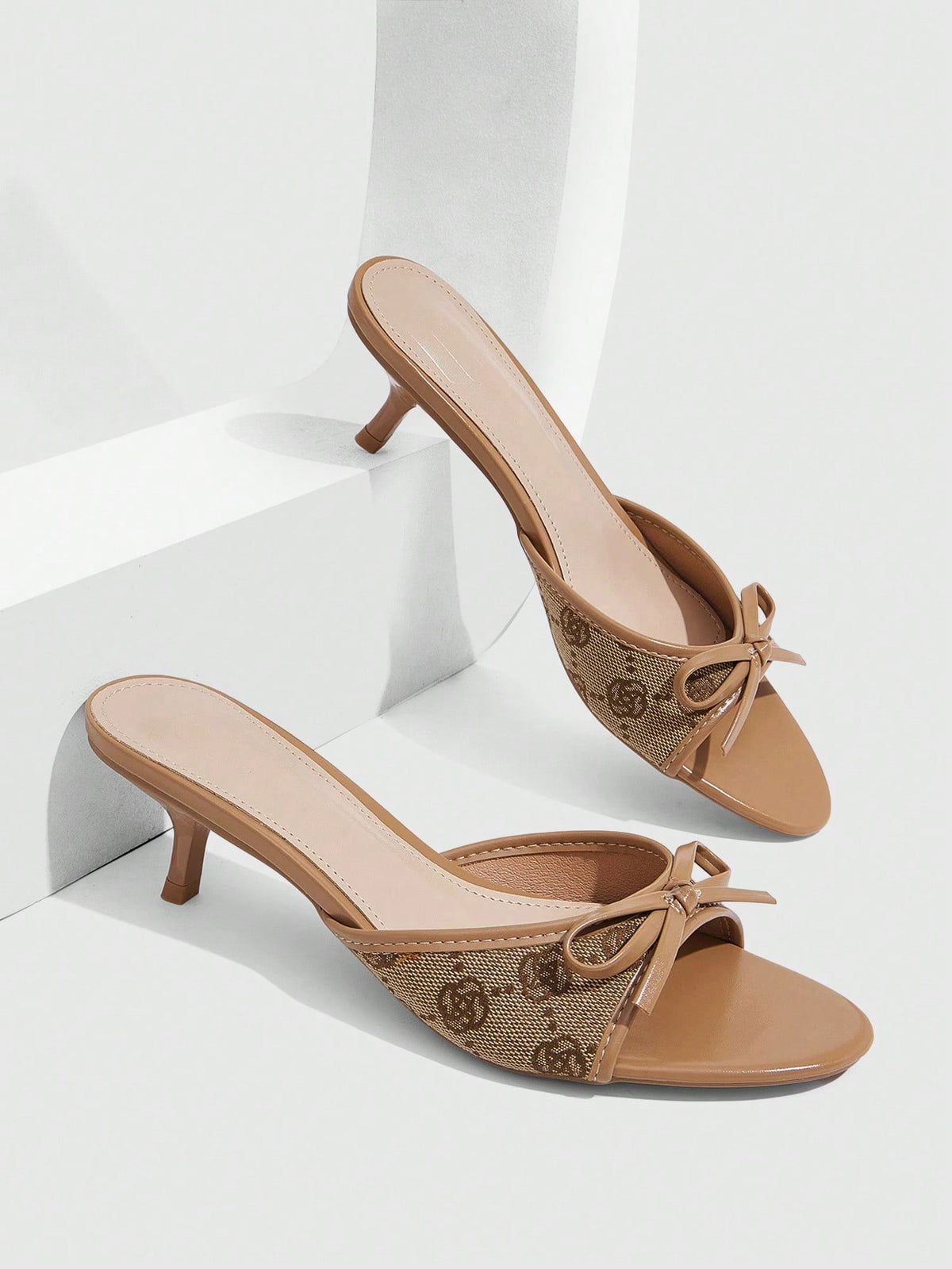 Burgundy high heel sandals for women featuring an open toe, decorative bow, 5.5cm kitten heel, and slingback strap.