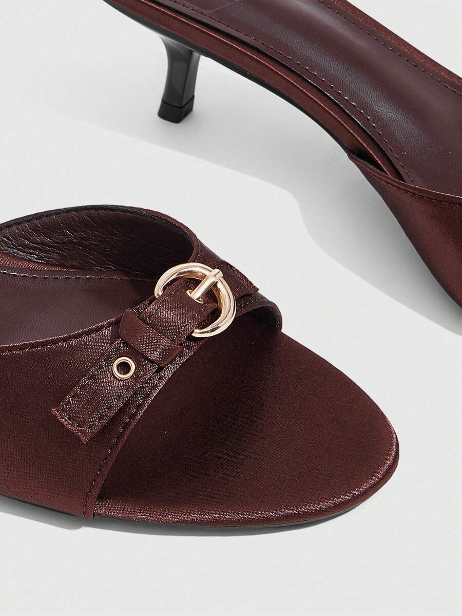 Women's light gold kitten heel slingback sandals featuring an open toe and round buckle strap.