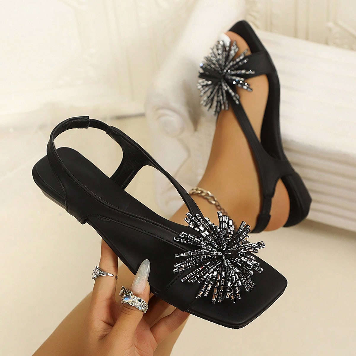 Women's square toe kitten heel thong sandals featuring a sleek toe-post strap and low heel design