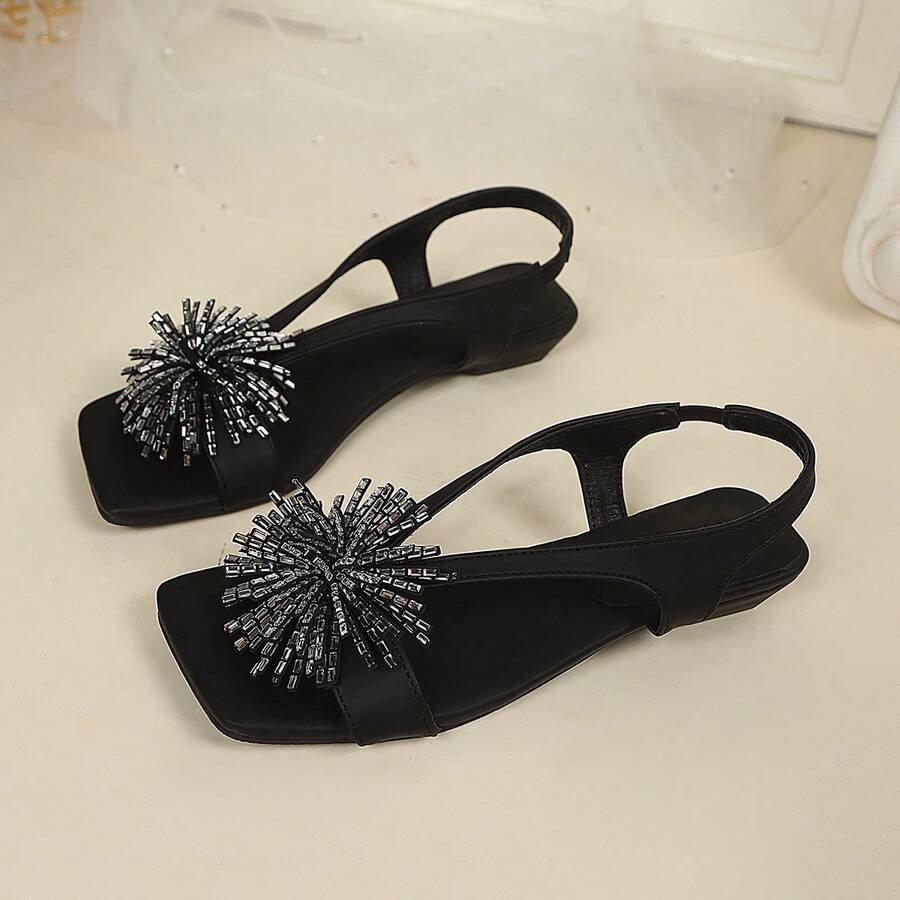 Women's square toe kitten heel thong sandals featuring a sleek toe-post strap and low heel design