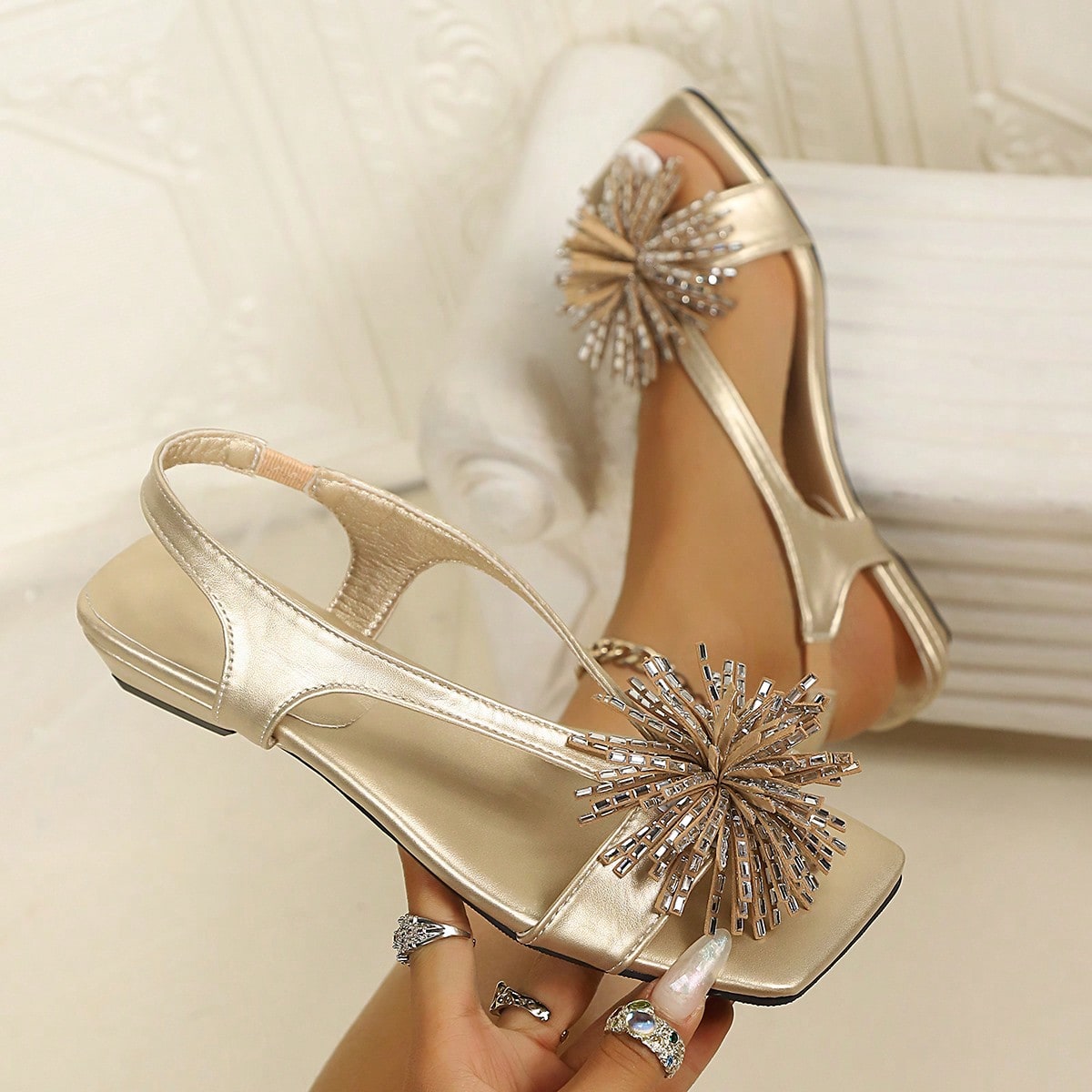 Women's square toe kitten heel thong sandals featuring a sleek toe-post strap and low heel design