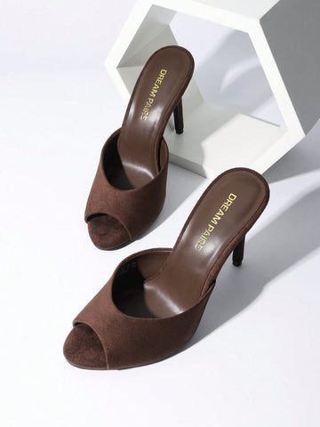 Women's peep toe stiletto mule sandals in white featuring a sleek high heel and slip-on design for party and wedding wear.