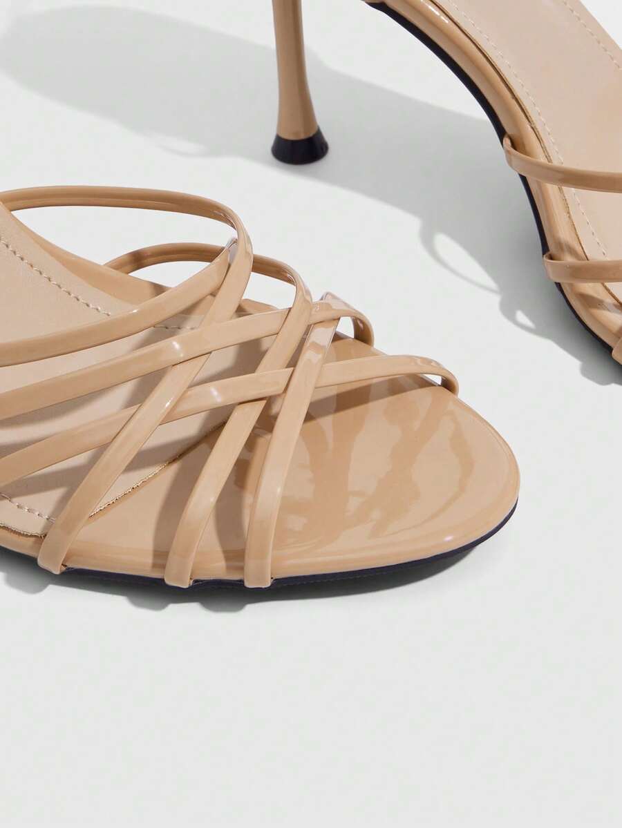 Women's cross strap square heel sandals featuring open toe and slingback design