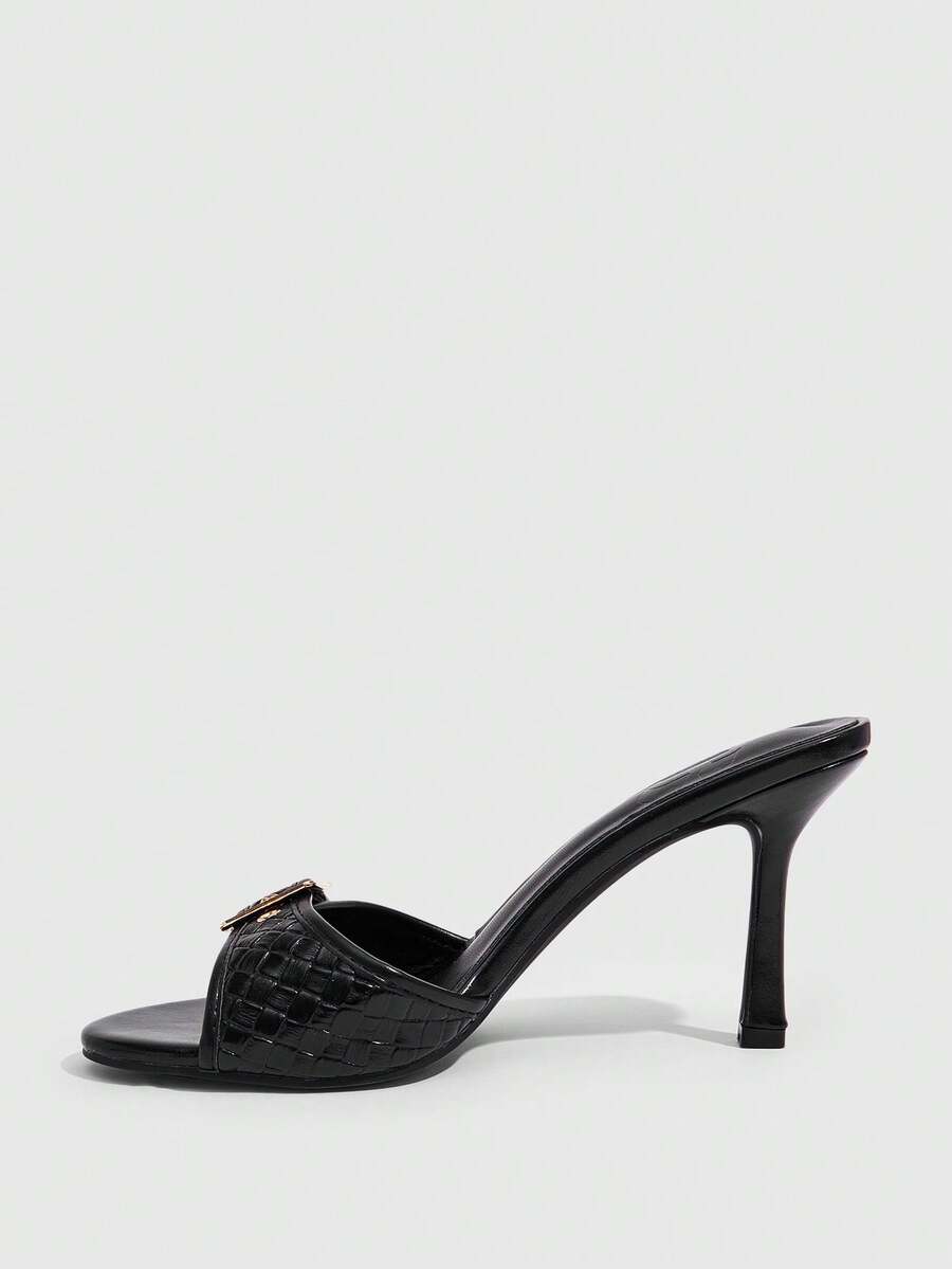 Women's brown leopard print high heel mule sandals with gold-tone buckle and grommet eyelet accents.