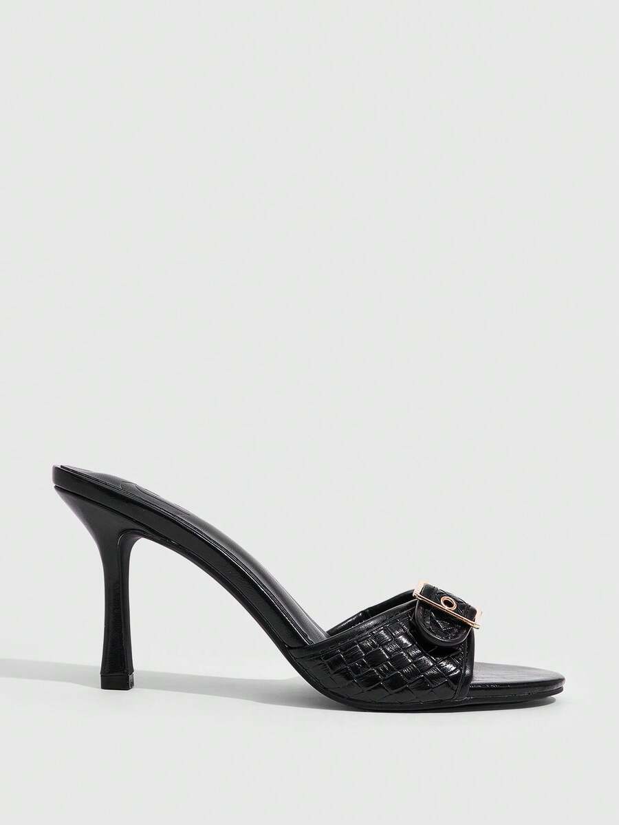 Women's brown leopard print high heel mule sandals with gold-tone buckle and grommet eyelet accents.