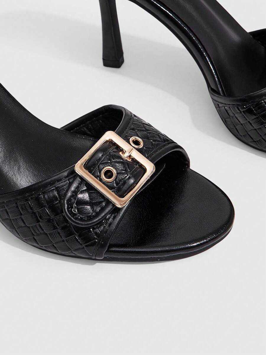 Women's brown leopard print high heel mule sandals with gold-tone buckle and grommet eyelet accents.