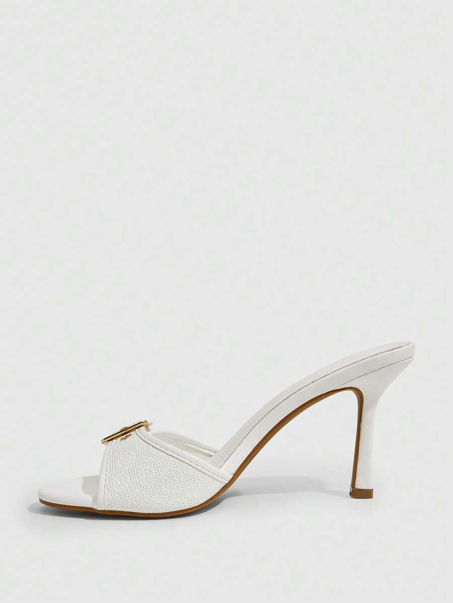 Women's brown leopard print high heel mule sandals with gold-tone buckle and grommet eyelet accents.