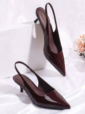 Pointed toe slingback kitten heel pumps in burgundy patent leather with low heel and slip-on strap for women