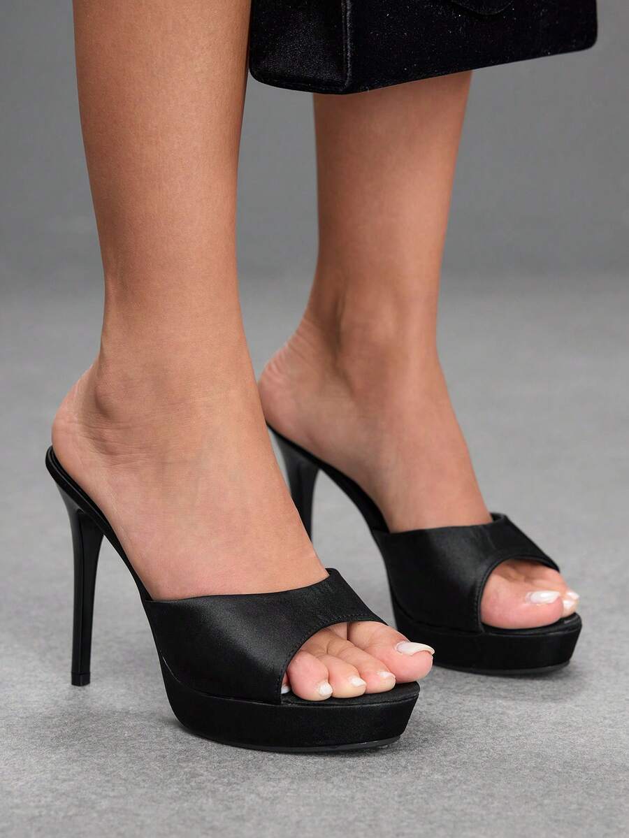 Women's open-toe round toe stiletto high heel sandals featuring a sleek slingback strap and elegant mid-heel design.