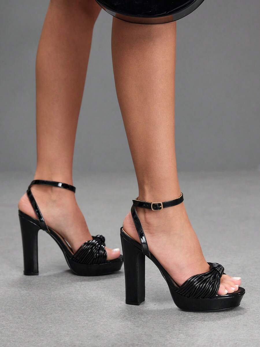 Women's platform block heel sandals featuring an open toe design and an adjustable ankle strap buckle closure.