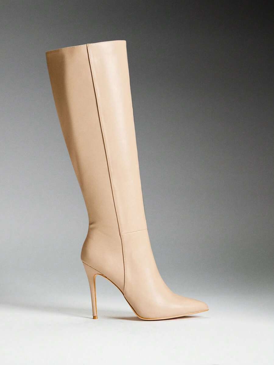Women's black pointy toe stiletto heel boots featuring a side zipper closure and sleek faux leather finish.