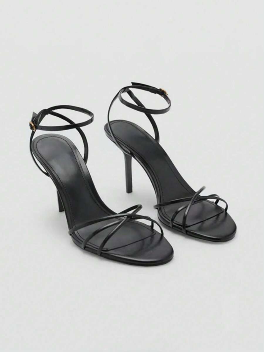 Women's open toe stiletto high heel sandals featuring metallic knot decor and an adjustable ankle buckle strap.