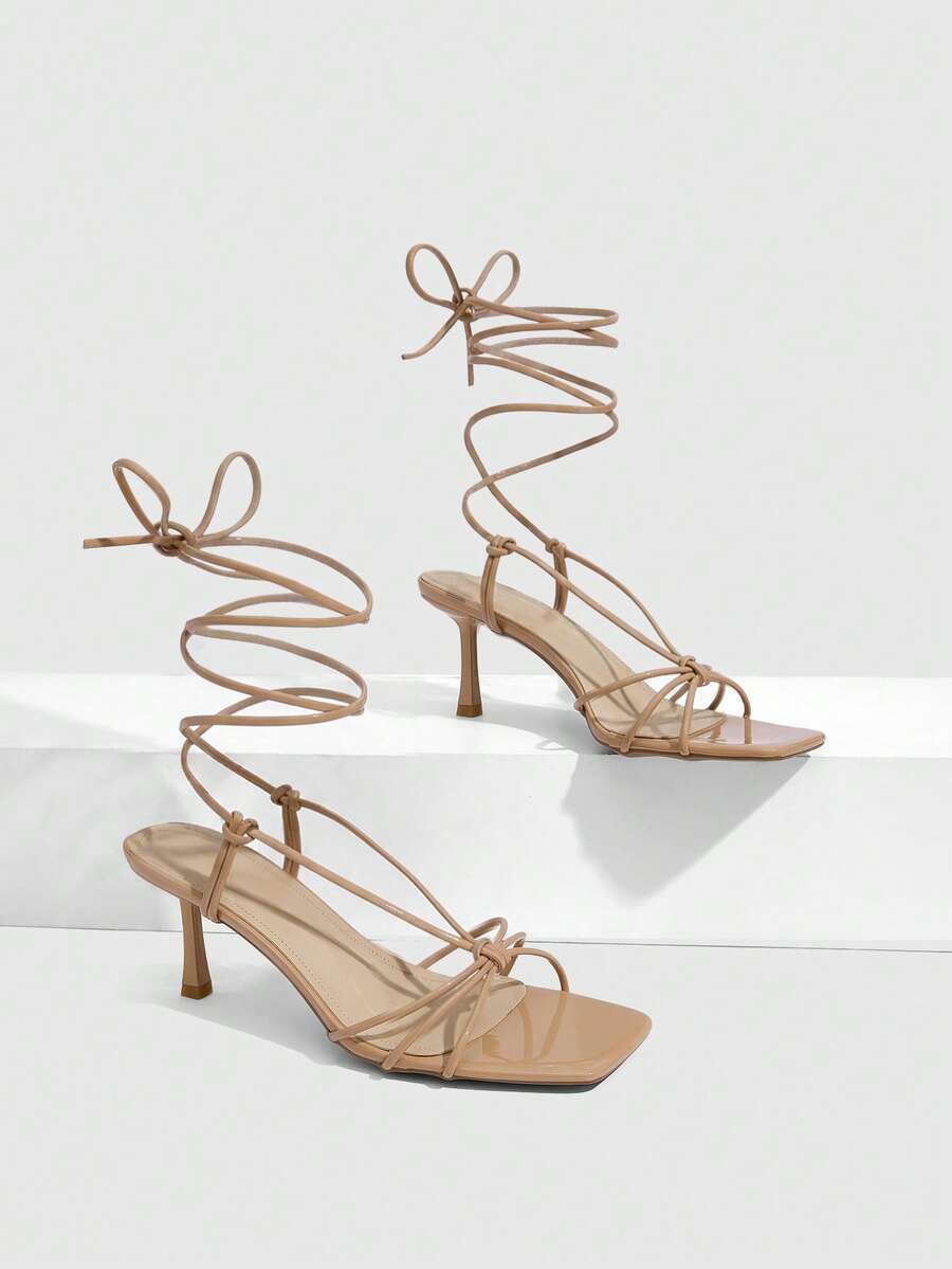 Women's square toe stiletto heel slingback sandals featuring sleek straps and buckle closure in a backless design.