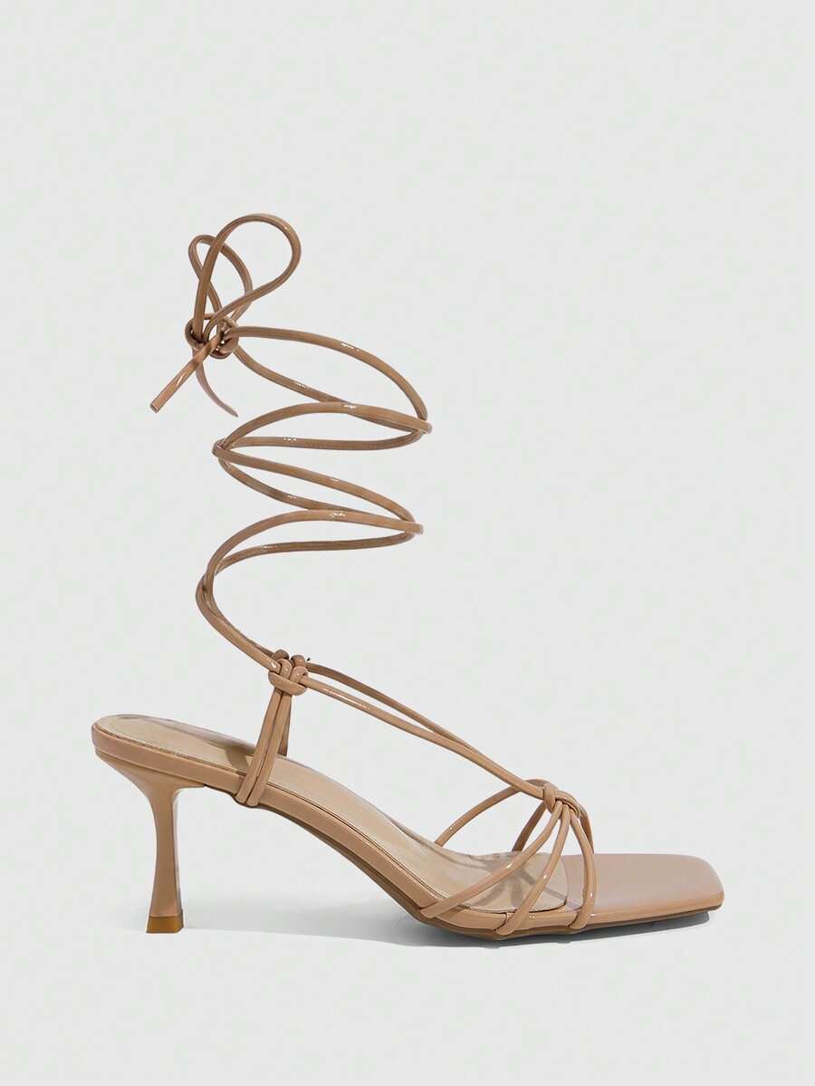 Women's square toe stiletto heel slingback sandals featuring sleek straps and buckle closure in a backless design.