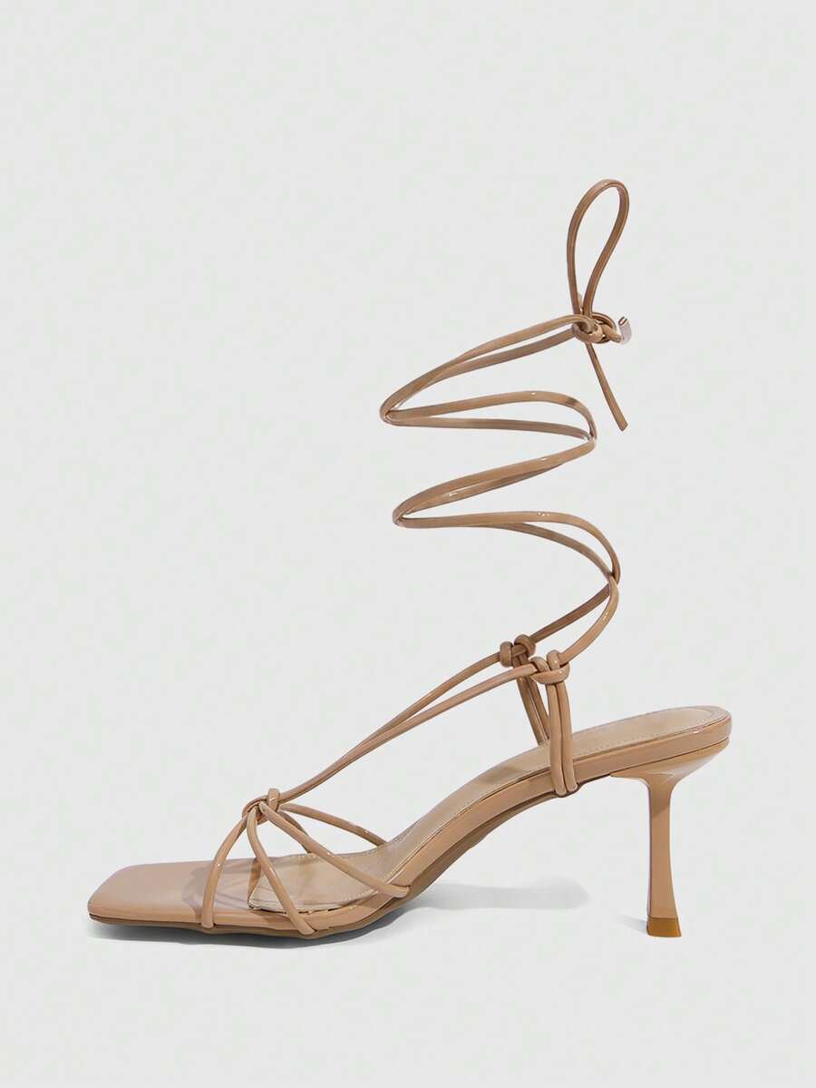 Women's square toe stiletto heel slingback sandals featuring sleek straps and buckle closure in a backless design.