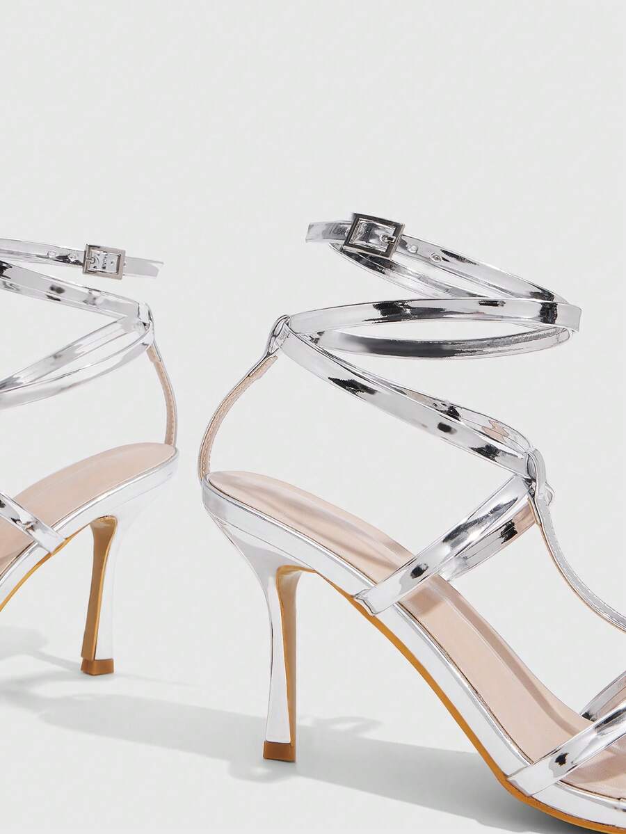 Women's open round toe high heel sandals with thin stiletto heel, hollow strap design, and ankle buckle closure.