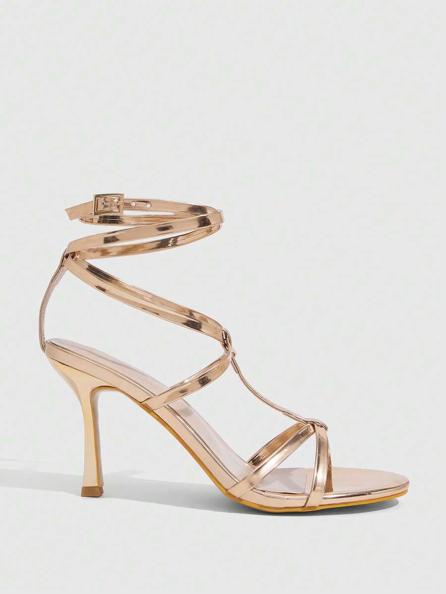 Women's open round toe high heel sandals with thin stiletto heel, hollow strap design, and ankle buckle closure.