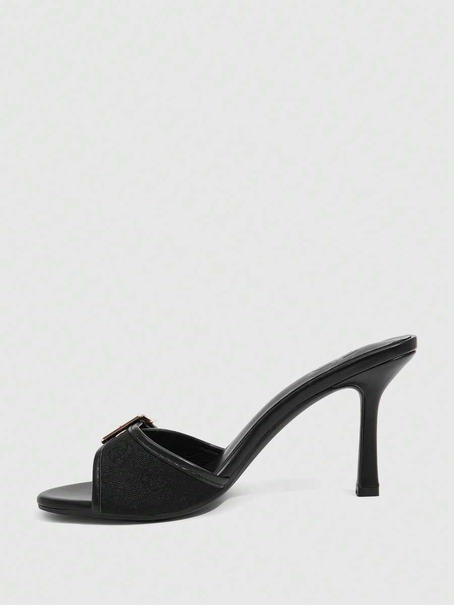Women's brown leopard print high heel mule sandals with gold-tone buckle and grommet eyelet accents.