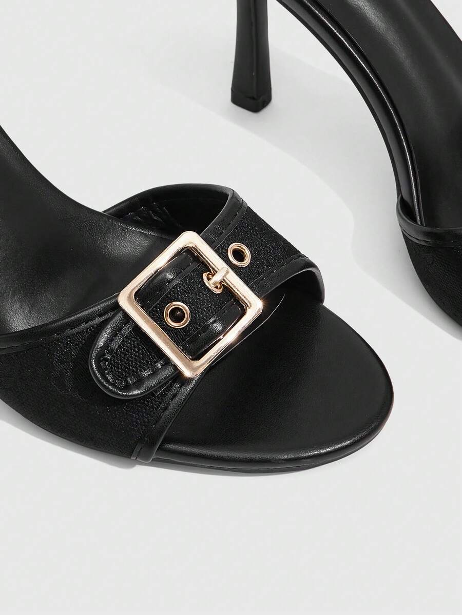 Women's brown leopard print high heel mule sandals with gold-tone buckle and grommet eyelet accents.