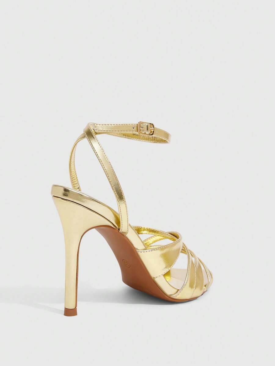 Women's open toe high stiletto sandals with cut-out cross straps and adjustable ankle buckle closure.