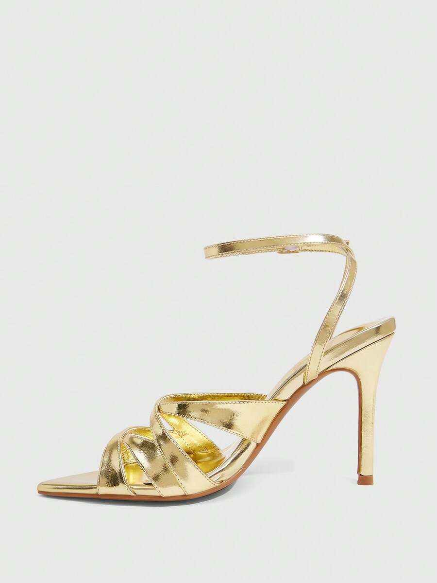 Women's open toe high stiletto sandals with cut-out cross straps and adjustable ankle buckle closure.