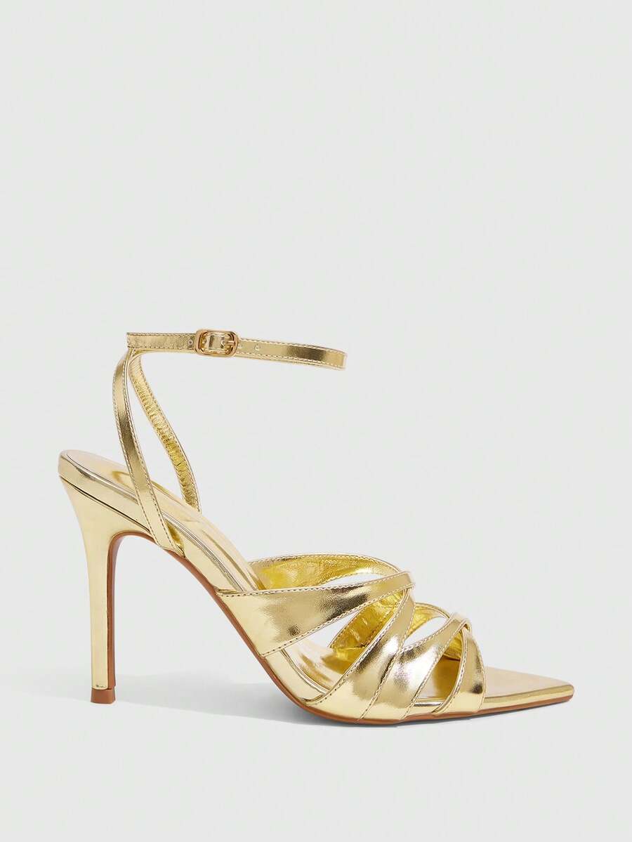 Women's open toe high stiletto sandals with cut-out cross straps and adjustable ankle buckle closure.