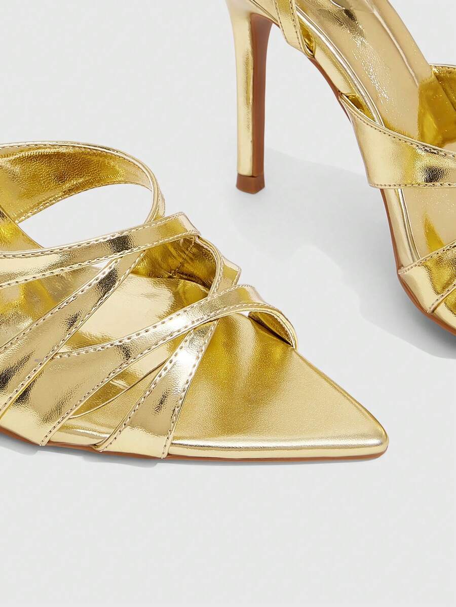 Women's open toe high stiletto sandals with cut-out cross straps and adjustable ankle buckle closure.
