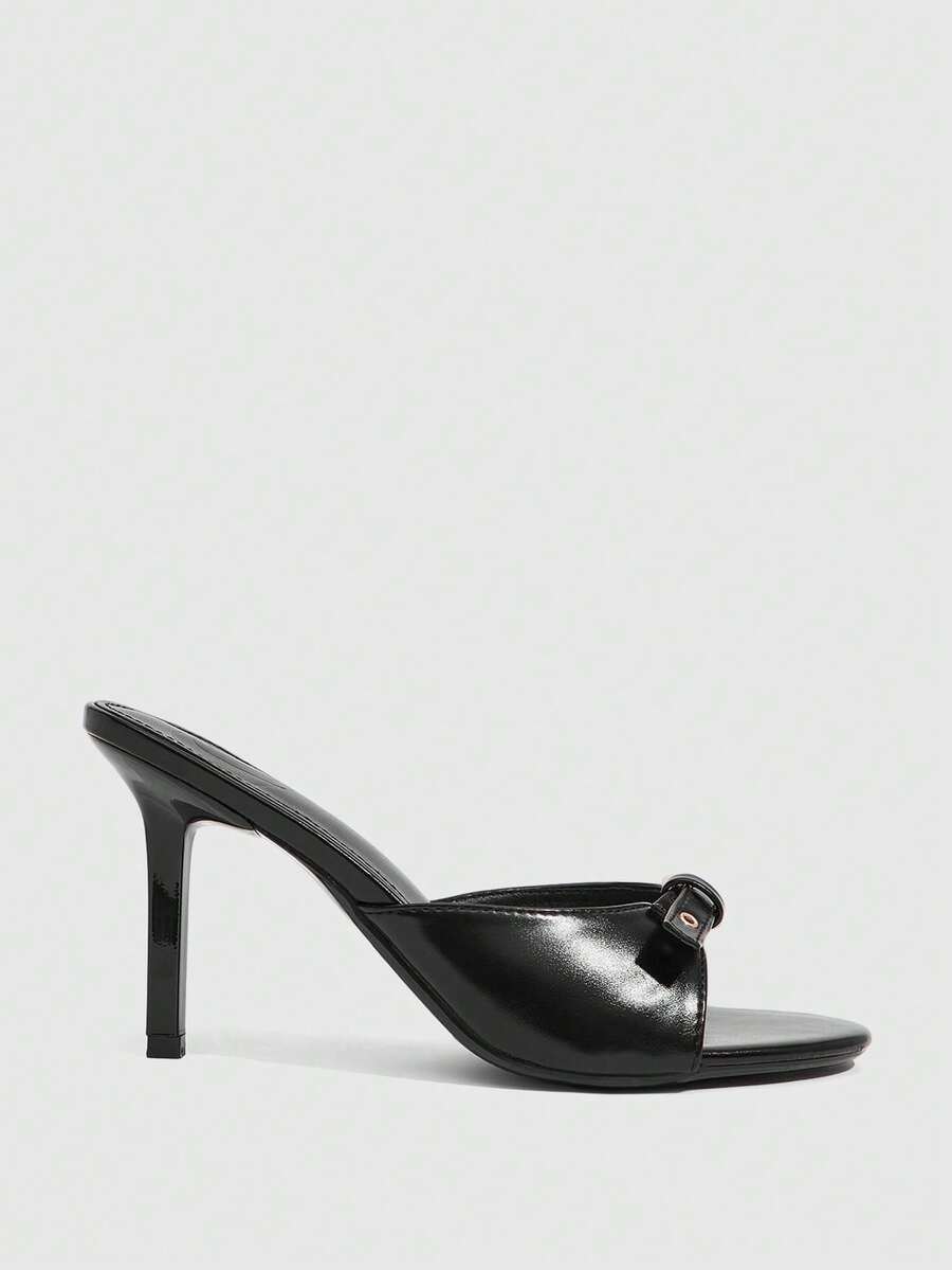 Elegant burgundy high heel slingback sandals with an open toe and round buckle strap.