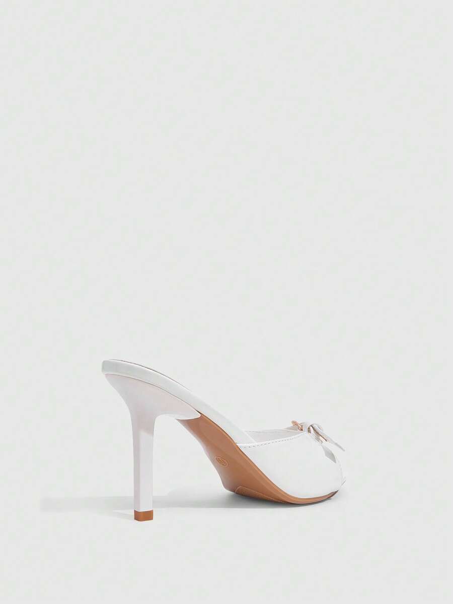 Elegant burgundy high heel slingback sandals with an open toe and round buckle strap.