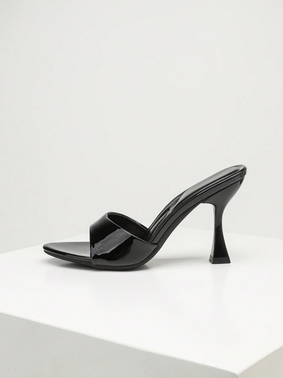 Women's open toe high heel sandals with slingback strap and sleek stiletto heel in smooth PU leather.