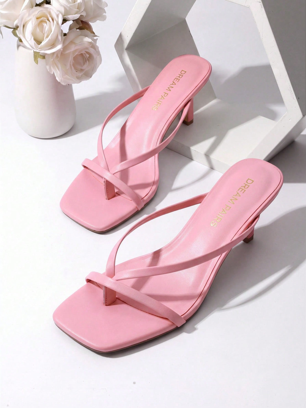 Women's metallic kitten low heel thong sandals featuring an open square toe and slip-on mule design.