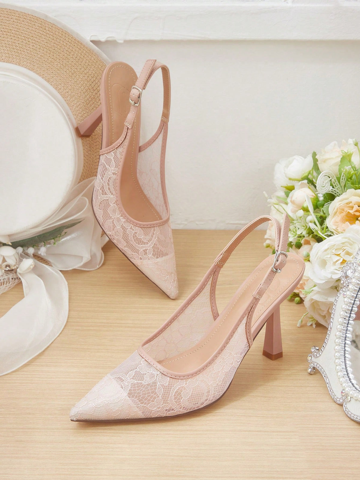 High heel wedding slingback pumps featuring delicate lace mesh upper, pointed toe, buckle strap, and stiletto heel
