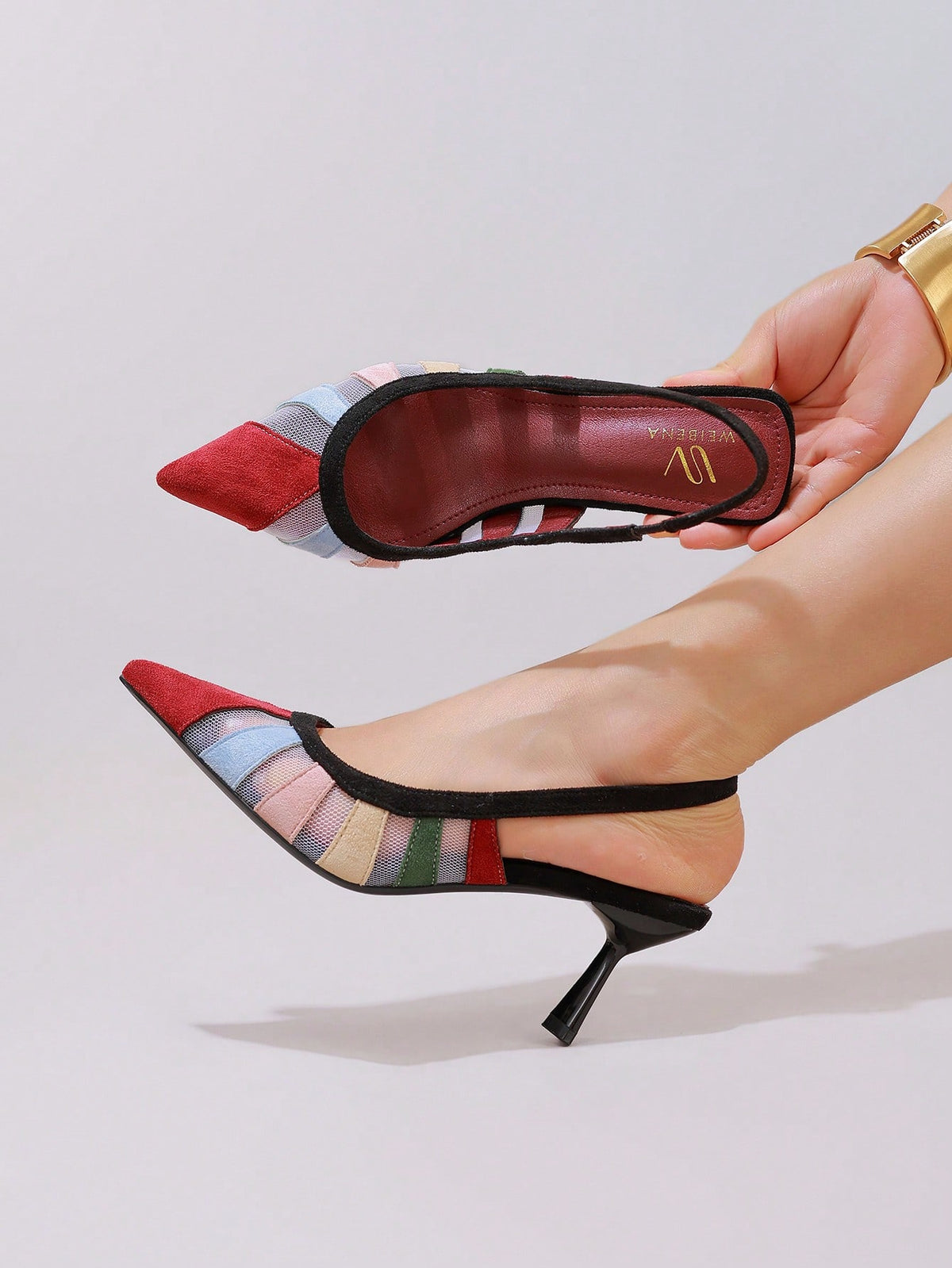 Black lace pointed toe high heel pumps featuring stiletto heels and a decorative bow accent.