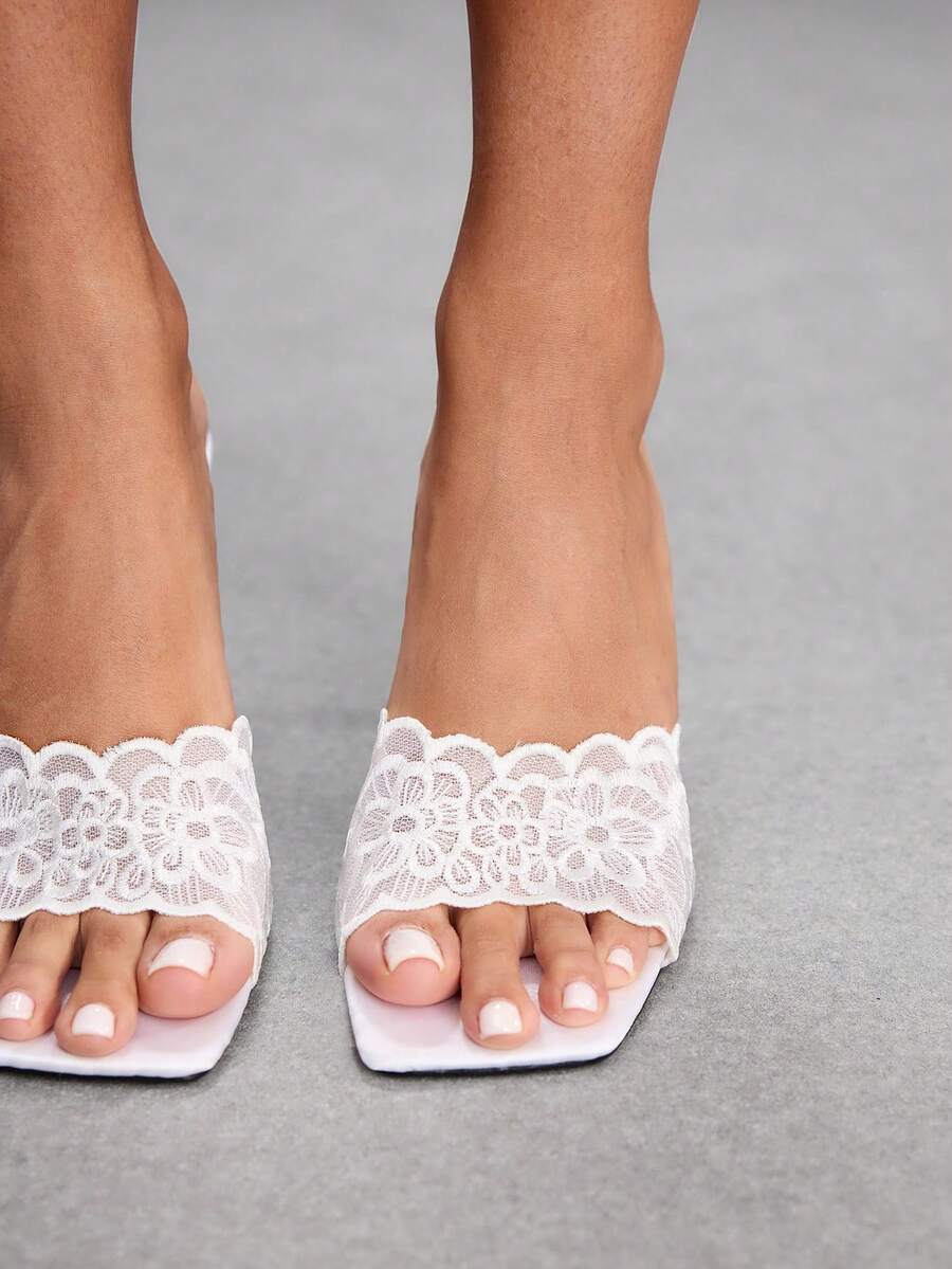 Women's square toe stiletto high heel slide sandals featuring contrast mesh embroidery and an open-toe backless design.