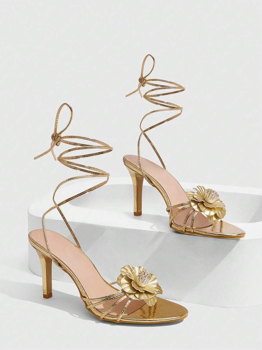 Women's golden snake pattern pointed toe thin heel strap sandals with three-dimensional camellia accent