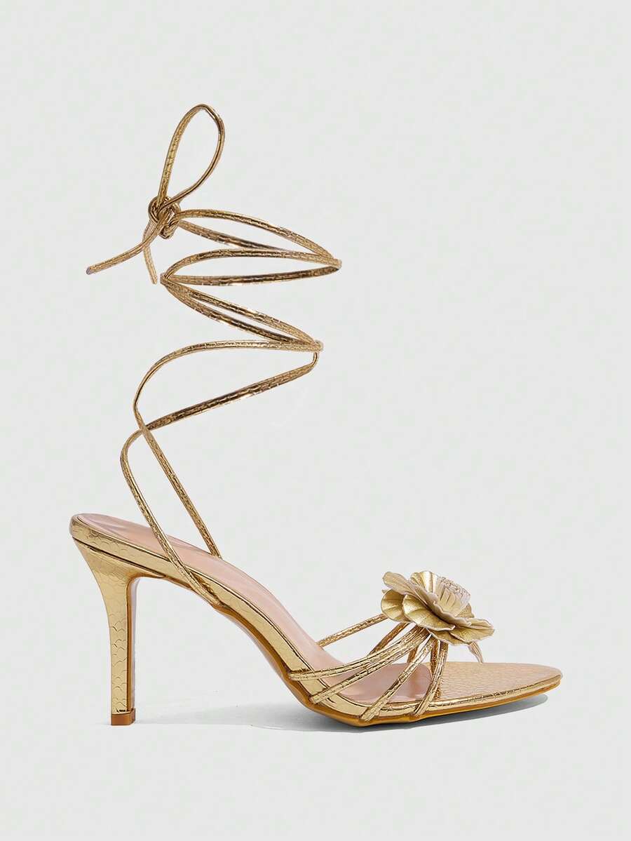 Women's golden snake pattern pointed toe thin heel strap sandals with three-dimensional camellia accent