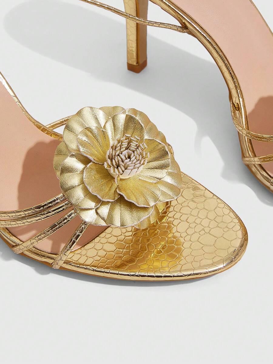 Women's golden snake pattern pointed toe thin heel strap sandals with three-dimensional camellia accent