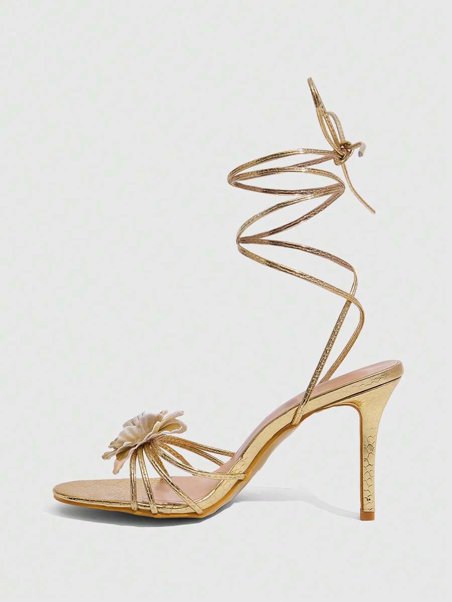 Women's golden snake pattern pointed toe thin heel strap sandals with three-dimensional camellia accent