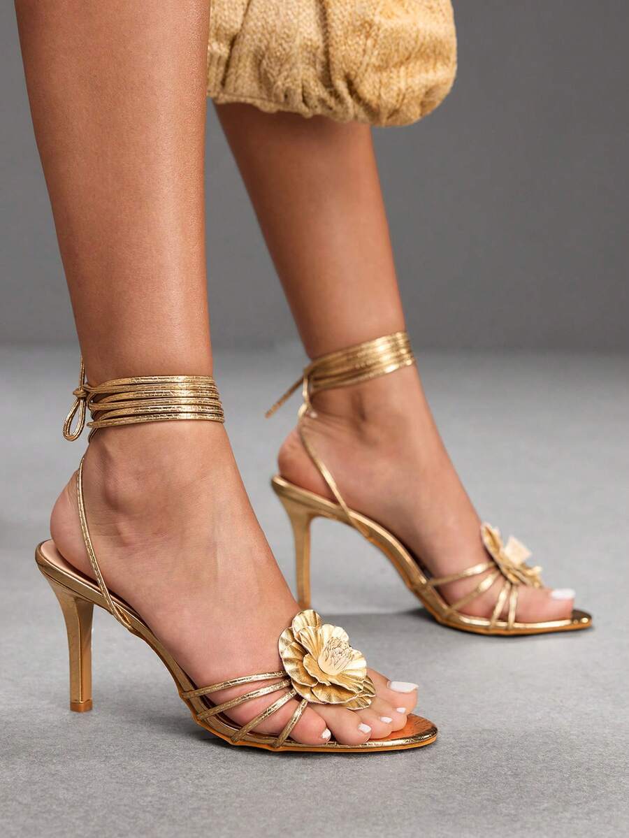 Women's golden snake pattern pointed toe thin heel strap sandals with three-dimensional camellia accent