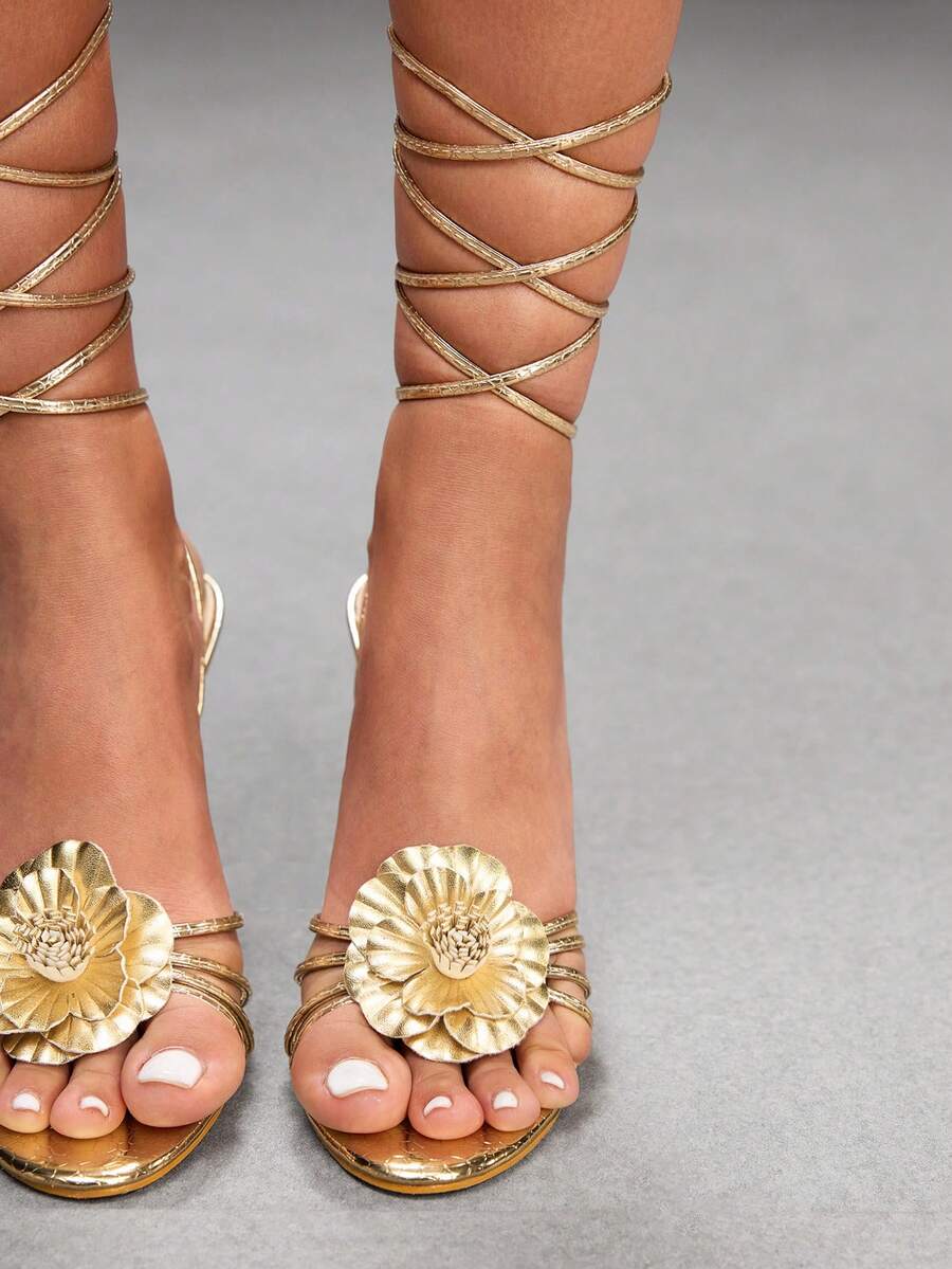 Women's golden snake pattern pointed toe thin heel strap sandals with three-dimensional camellia accent