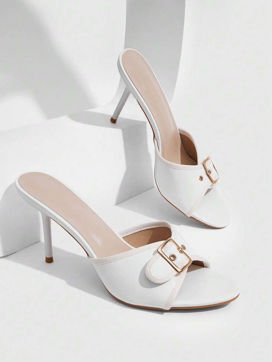Beige pointed toe mule high heel sandals featuring gold buckle accent