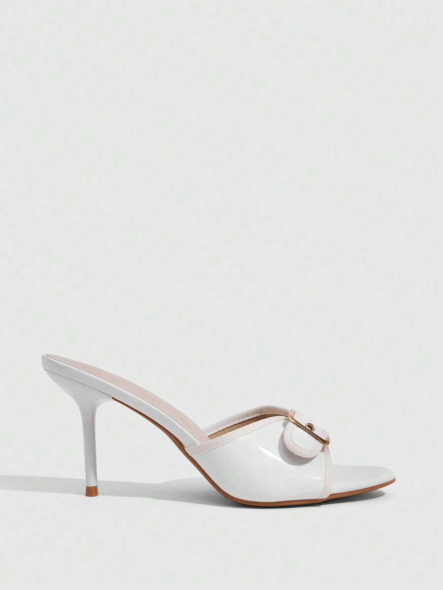 Beige pointed toe mule high heel sandals featuring gold buckle accent