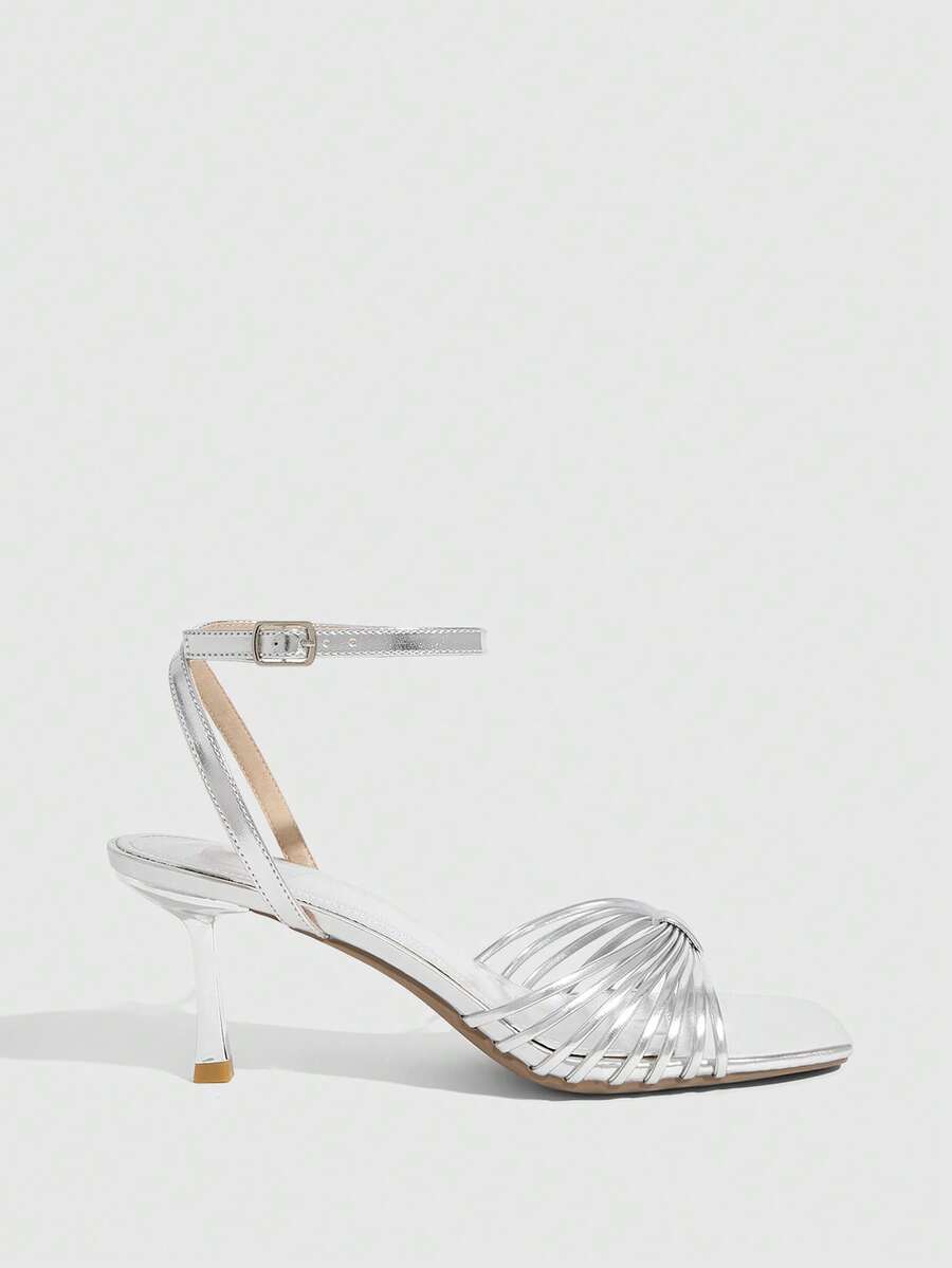 Women's open toe stiletto heel sandals featuring square toe design, criss-cross rhinestone slim straps, and secure ankle strap.