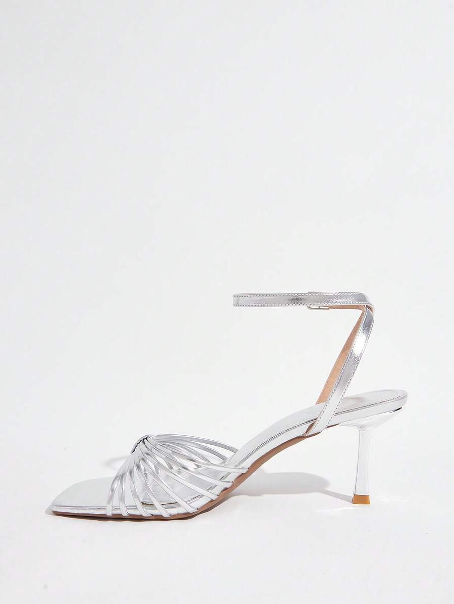 Women's open toe stiletto heel sandals featuring square toe design, criss-cross rhinestone slim straps, and secure ankle strap.