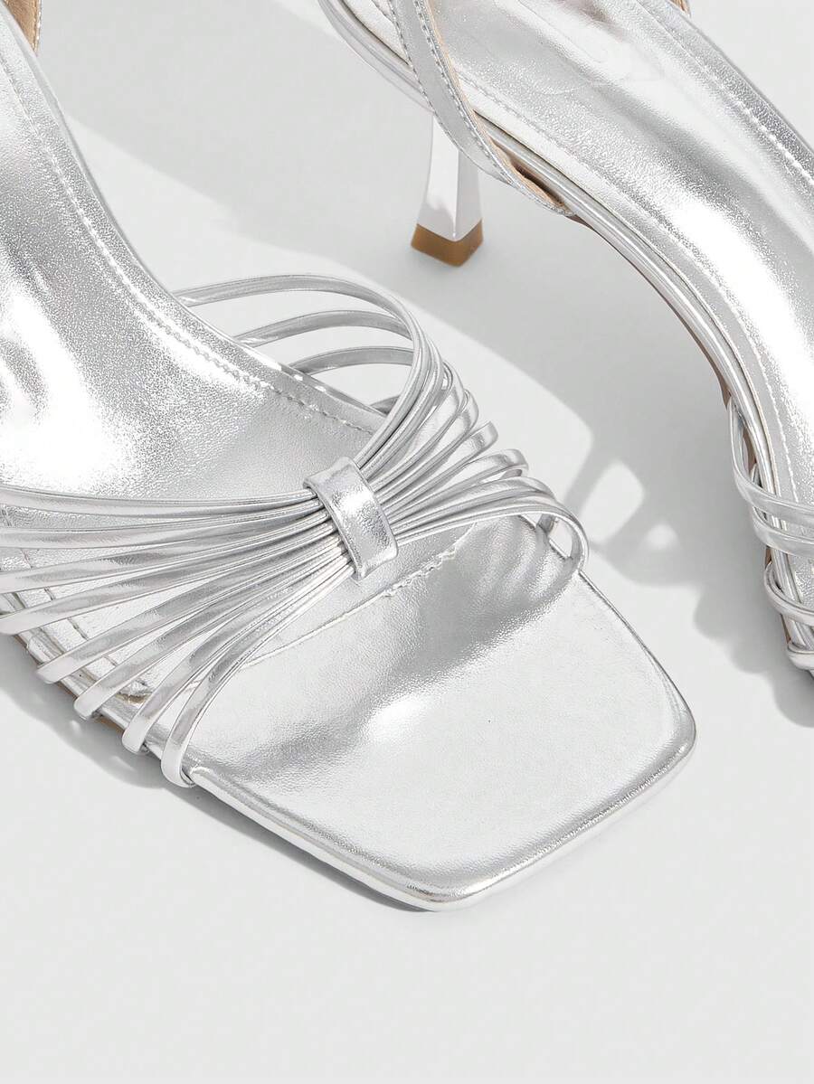 Women's open toe stiletto heel sandals featuring square toe design, criss-cross rhinestone slim straps, and secure ankle strap.
