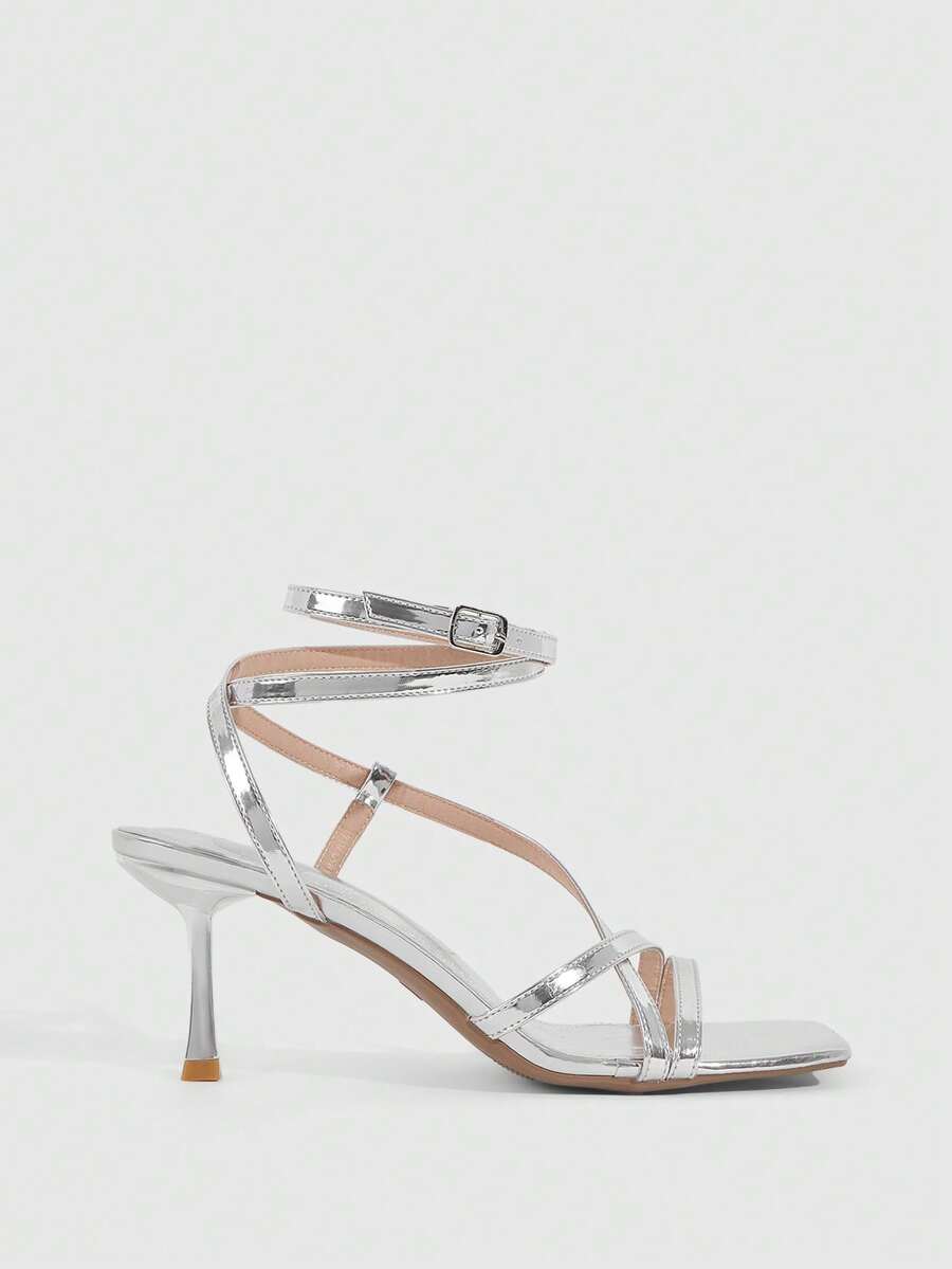 Women's open toe stiletto heel sandals featuring square toe design, criss-cross rhinestone slim straps, and secure ankle strap.