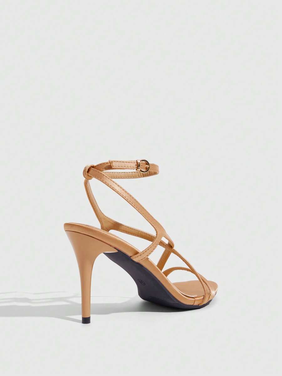 Square toe stiletto high heel sandals in deep burgundy satin featuring criss cross straps and an open toe design.